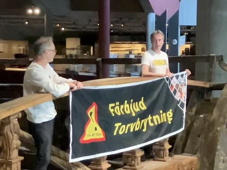 Activists from Återställ Våtmarker (Restore Wetlands) demonstrate against peat extraction on the Vasa ship in Stockholm.